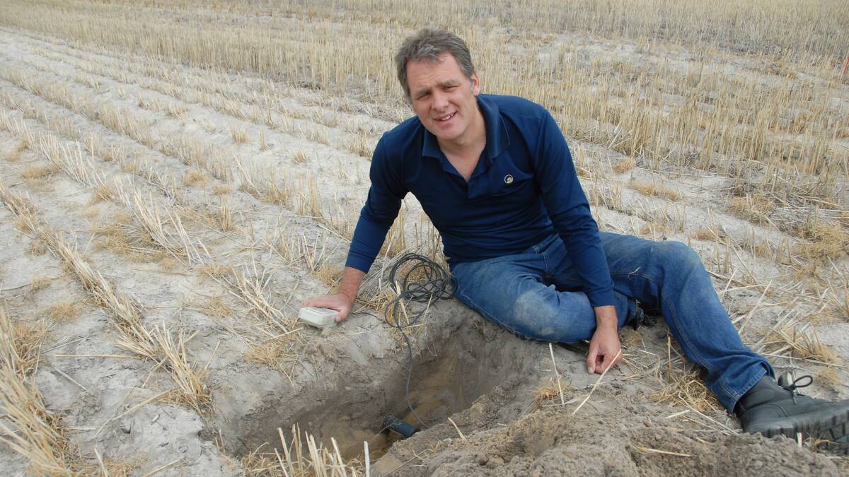 DAFWA research officer Dr Steve Davies measures the soil moisture content.