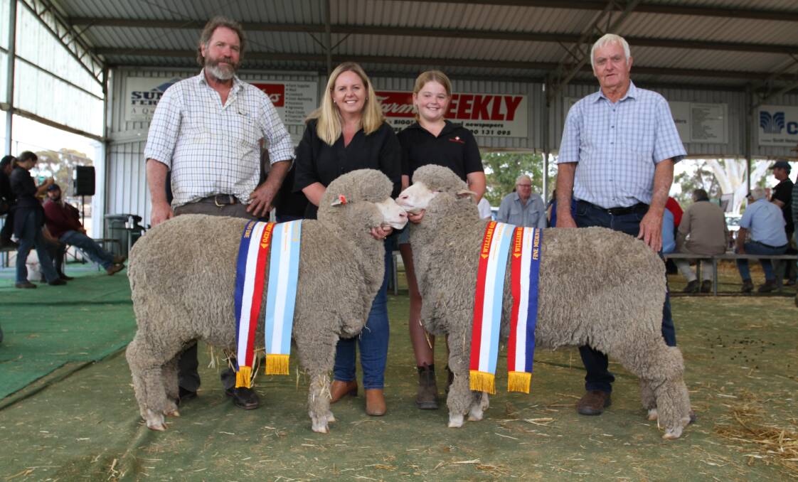 The King family, Rangeview stud, Darkan, exhibited both the grand and reserve grand champion Merino ewes. With the champion fine wool Merino ewe (reserve champion, left) and champion fine-medium wool Merino ewe (grand champion), were judge Iain Nicholson (left), Boorabbin and Colvin Park studs, New Norcia, Melinda and Erin King, Rangeview stud and judge Ray Edmonds, Calingiri.