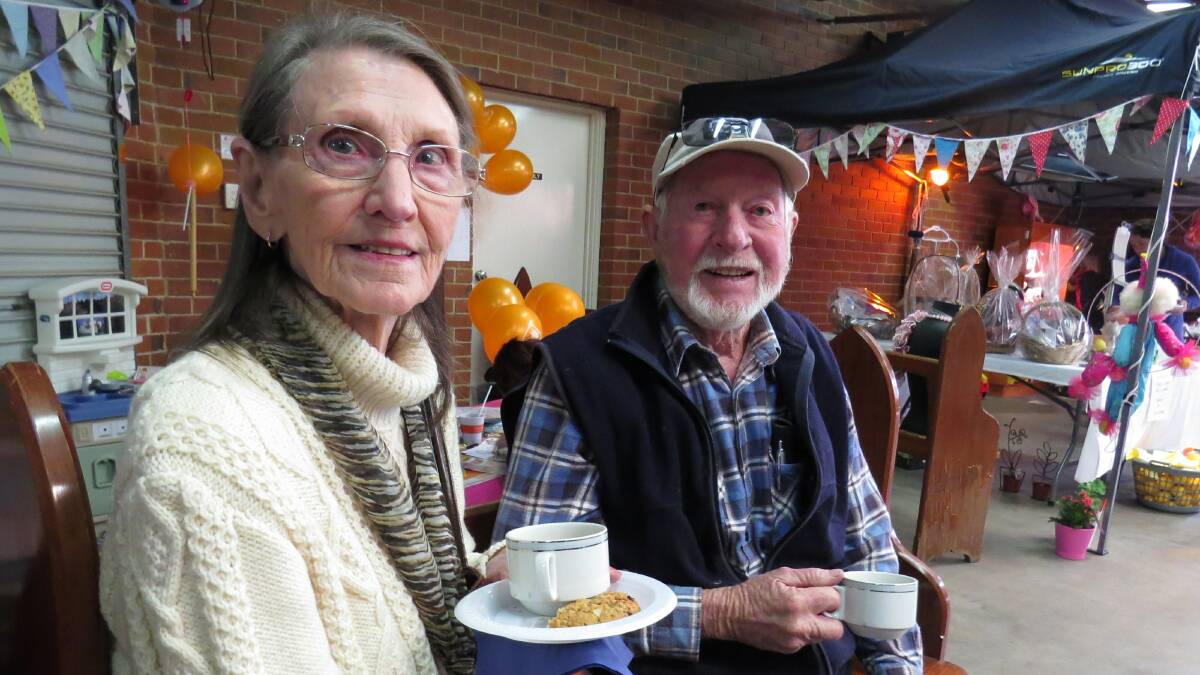 Smiles: Margaret and Robert Barry enjoy something to eat and drink at the rear of the courtyard on May 26.