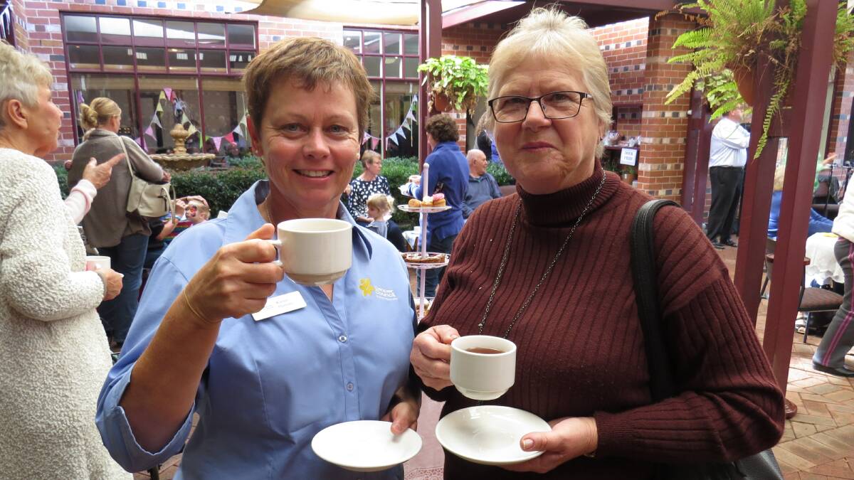 Cuppa: Karen Hansen and Maxine Walker enjoy the morning tea. The back of the courtyard was opened up this year to allow more space for people to mingle. 