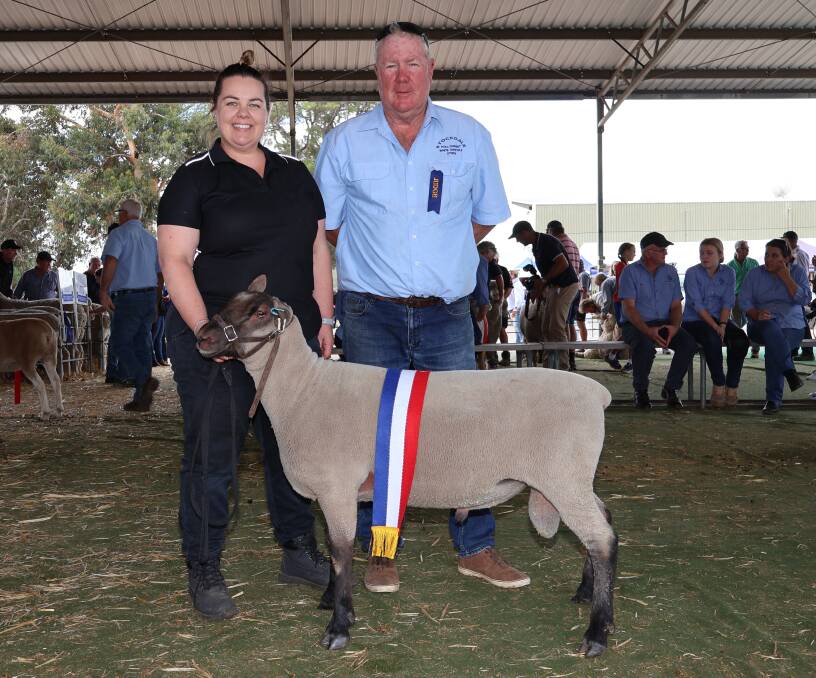 Iveston studs Stacey Bingham and judge Laurie Fairclough, Stockdale White Suffolk and Poll Dorset studs, York, with the champion South Suffolk ram exhibited by the Iveston stud, Williams.