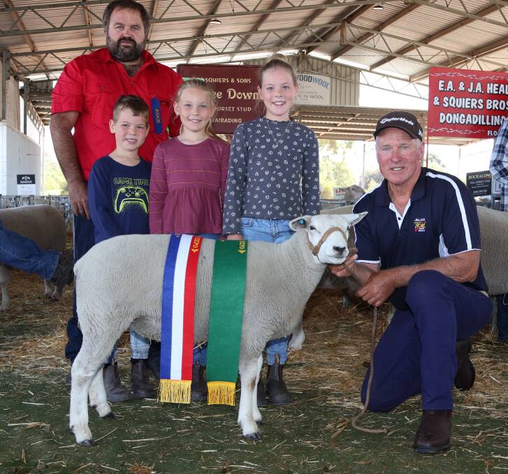 With the grand champion Texel and champion Texel ewe from the JimJan stud, Boyup Brook, were judge Aaron Foster (left) Wendenlea Suffolk and White Suffolk studs, Boddington, with JimJan principal Jim Glover and his grandchildren Lawson, 5, Adele, 8, and Lidia,10, Glover.

