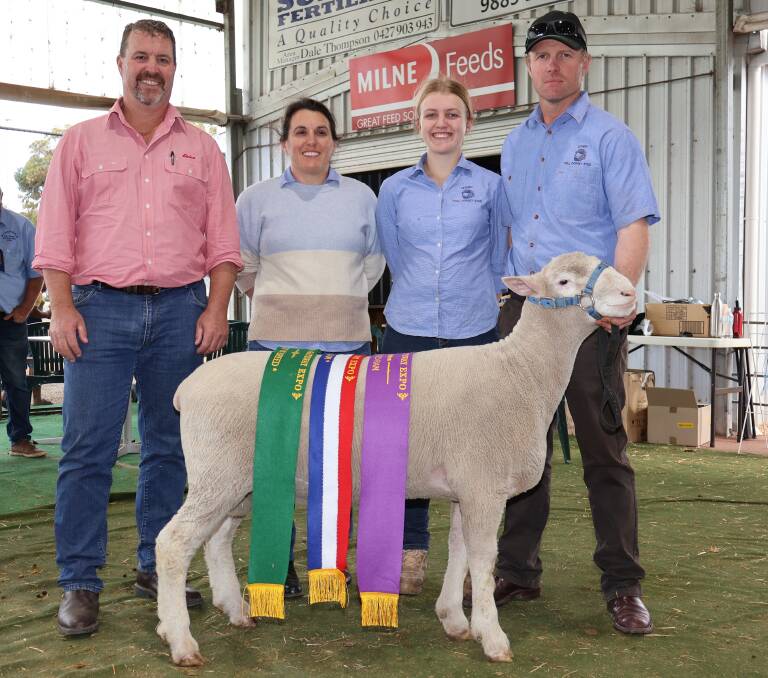 Sponsor representative for Elders, WA stud stock manager, Nathan King (left), Leween studs Claire, Maddi and Tim Shepherd, Narrogin, with their champion interbreed ram. The ram was also sashed the grand champion Poll Dorset and champion Poll Dorset ram.