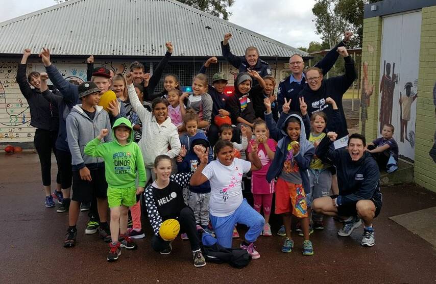 Avonvale students with Northam police and Fair Game Australia on Saturday, happy with their new sports equipment given to them by the organisation. 