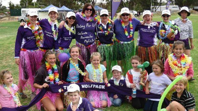 A group of participants enjoyed dressing up and taking part in the Avon Valley Relay for life charity event in 2014. 