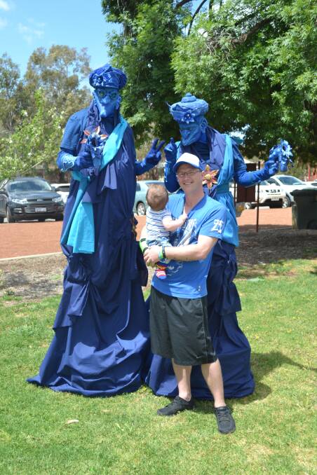 Logan and Corey Angwin amazed by the blue performers at Turn Up In Blue Day for Mental Health Week 2016 in Northam. 