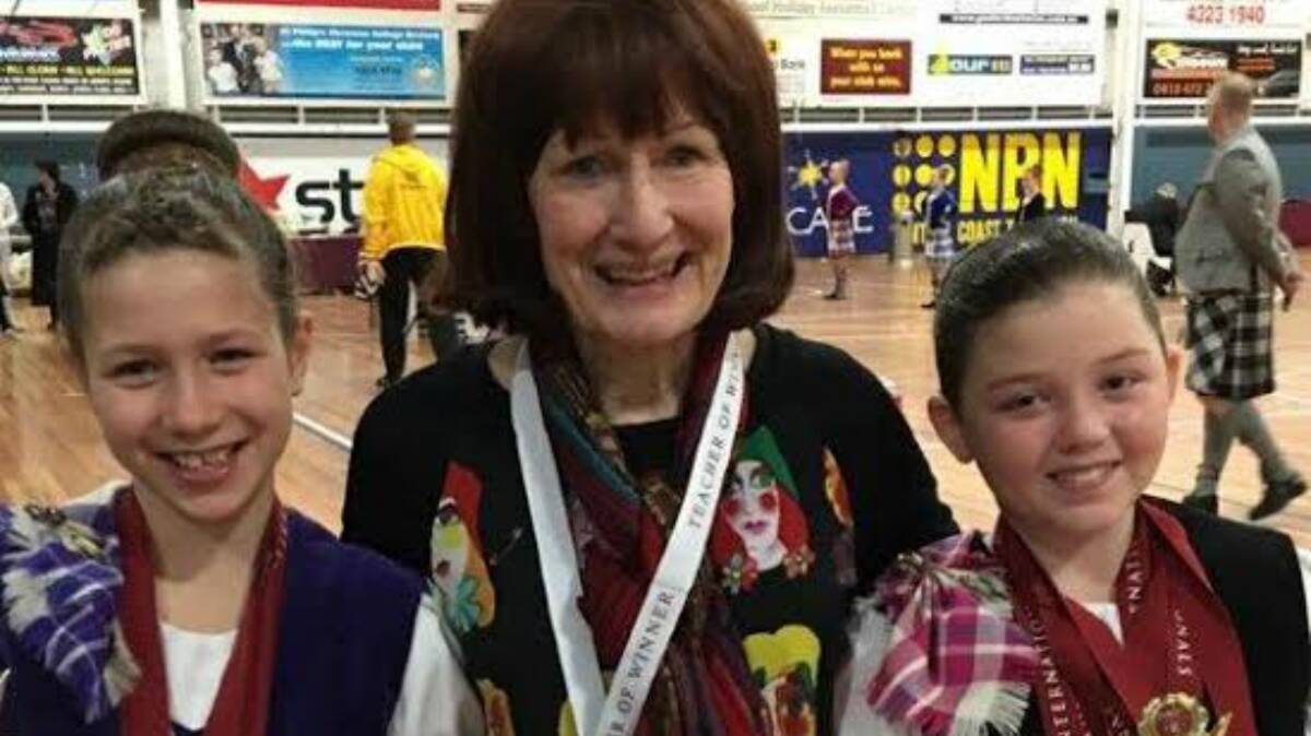Proud competitors: Charlotte Fieldhouse, dancing teacher Joy Smith and Charlotte Stephen at the International Highland Dancing Championships, Sydney. 