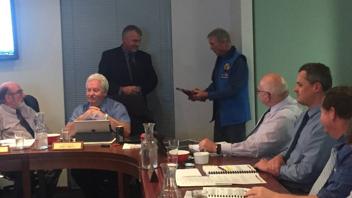 Northam Shire president receiving the plaque from Ron Bywaters at the council meeting. 