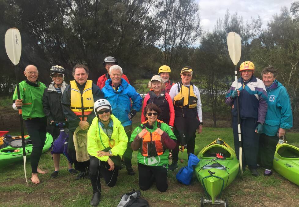 Paddling power: The Over 55 Canoe Club, rugged up to row down the river on August 8. 