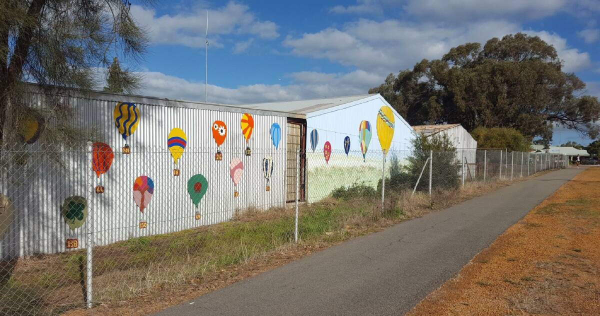 Spotted: A colourful display of 28 balloons, part of the treasure hunt competiion, have been placed along the Jubilee Pavilion at the Northam Recreation Centre. Photo: Karen Ducat. 