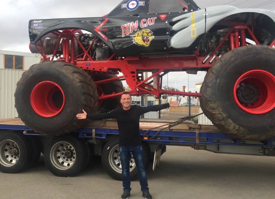 Ultimate Monster Truck organiser Adam Brand with one of the vehicles that will be in the Northam show. Two of the trucks are parked on Fitzgerald Street, awaiting the show next week.