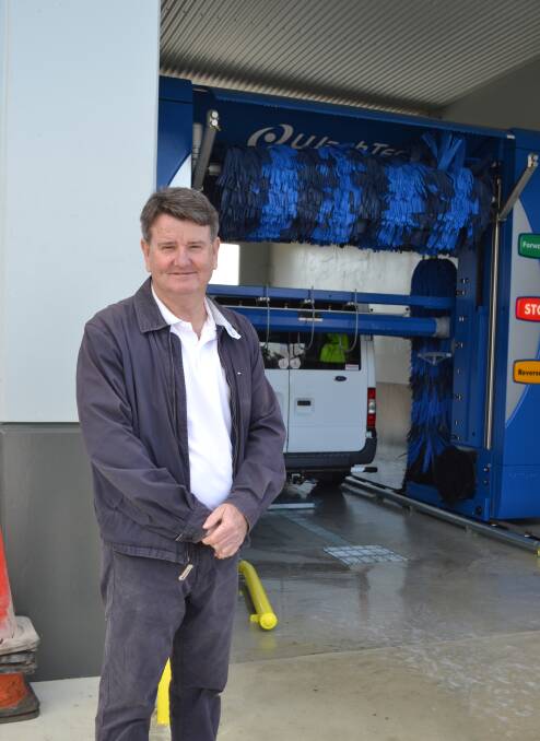 Bryan Lee standing next to the Super Bay automatic wash, in Northam.