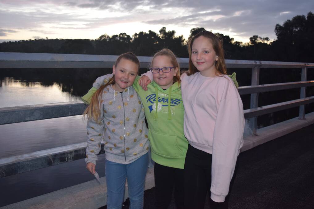 Historic event: Hayley Russell with Bonnie and Olivia Burrow walking on the renovated Avon Bridge in Northam, for the first time at the official opening on Saturday evening. 