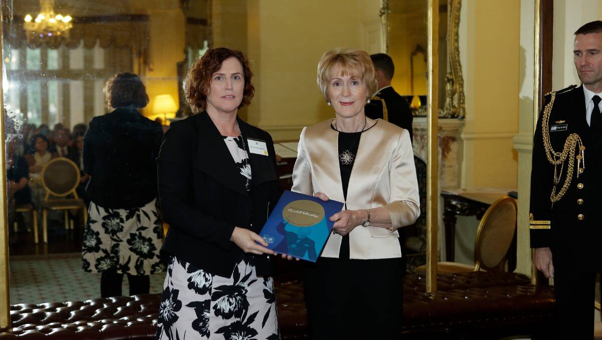 Caroline Langston receives her Winston Churchill Fellowship award from Governor Kerry Sanderson. Photo: supplied.