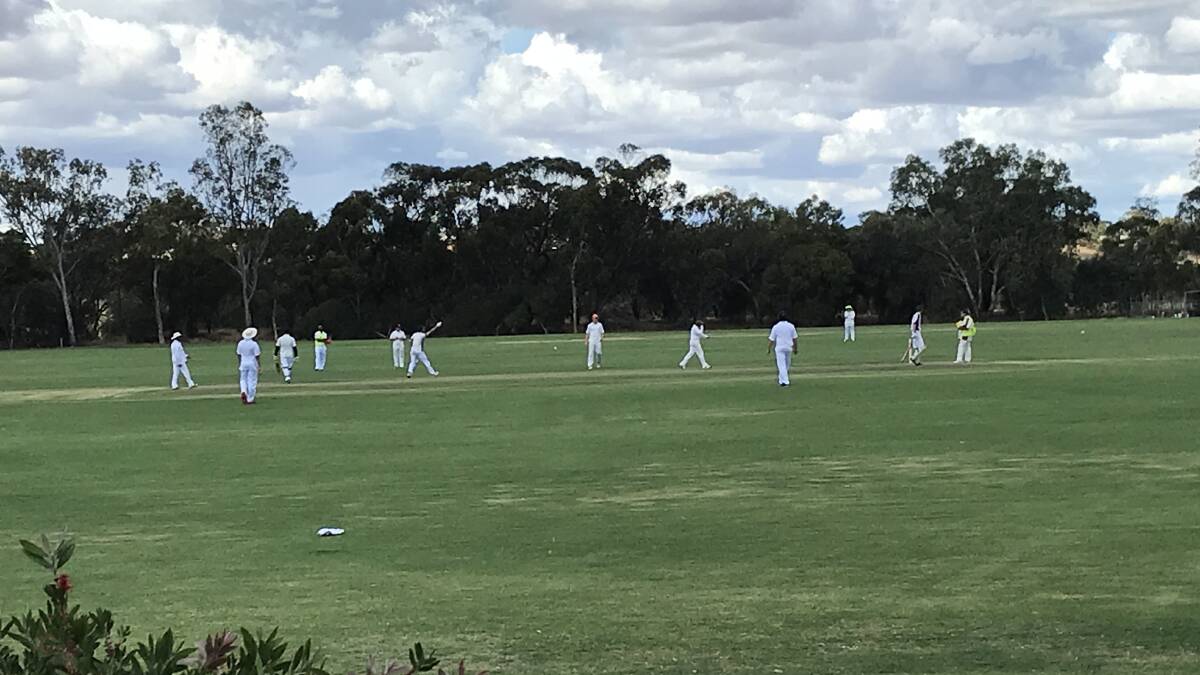 Cricketers in action despite light showers at Bert Hawke oval on the weekend. Photo supplied.