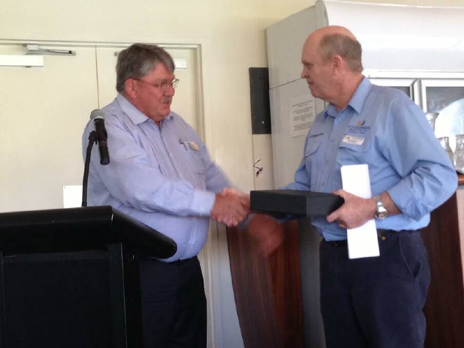 Award: CY O'Connor Institute lecturer Sid Woodvine, right, accepts his achievement award from Farm Machinery and Industry Association of WA president Alan Fisher.