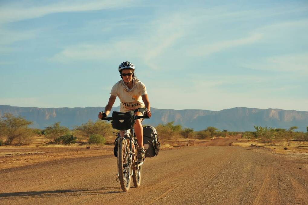 On the road: Kate on her bike during one of her travels.