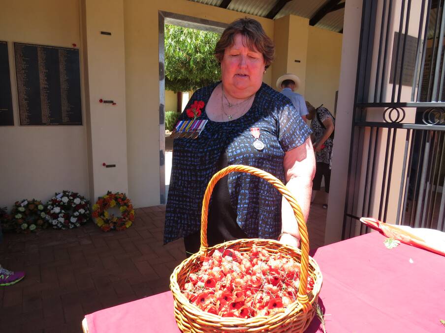 Reflection: Northam RSL president Donna Prytulak handed out poppies.