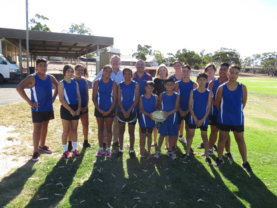 Warriors: Coach James West, Member for Central Wheatbelt Mia Davies and Paul Brown MLC with the Warriors touch rugby team.