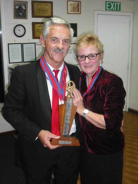 Club Champion 2013-14: Peter Hill with Mavis McLaugh lin.