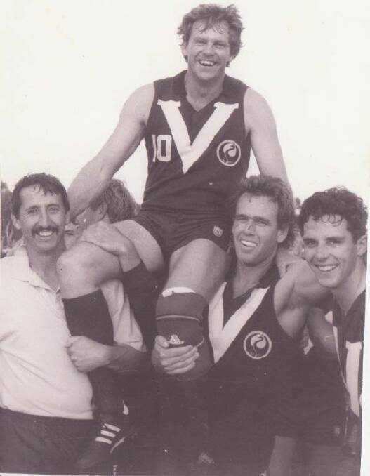 Champ: Bruce Smith is chaired off the ground after his last game, in the 1994 grand final. With him is Paul Hitchcock and Lyndon Bird. Both Lyndon and Bruce are members of the team of the century squad.