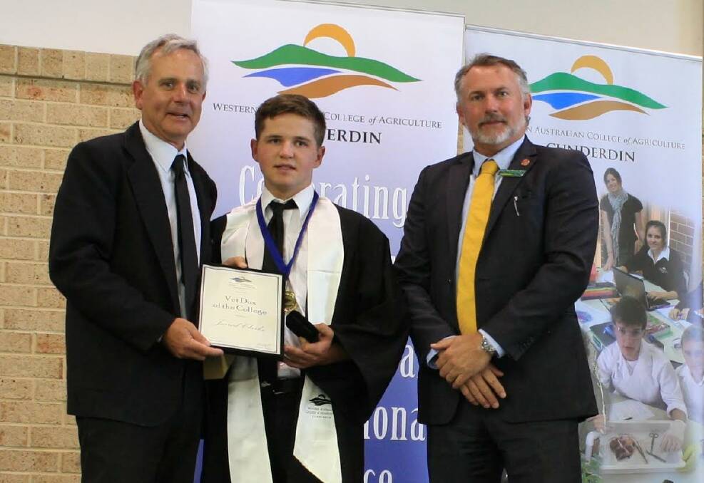 Top student: Dux Matthew Lane, from Wongan Hills receives his award from WA College of Agriculture  Cunderdin principal Bernard Beatty as Paul Brown MLC looks on.