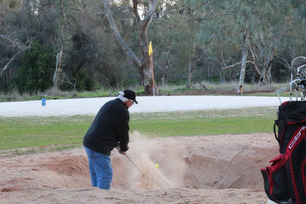 Difficult shot: M Oshea finding out how hard the bunkers are.