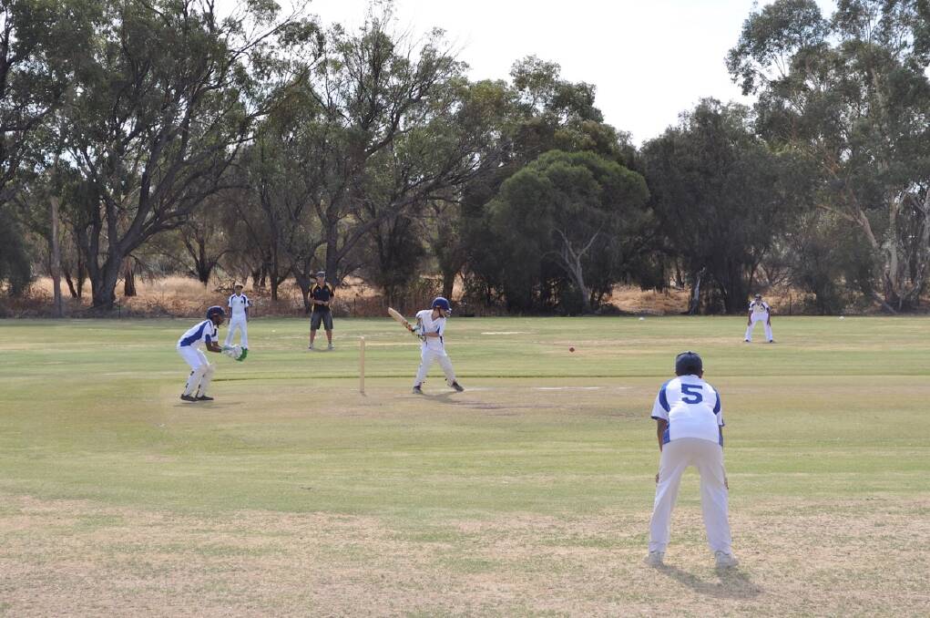 Action: Action from 2013-14 under 13s grand final between Northam Primary and AvonWest Blue.