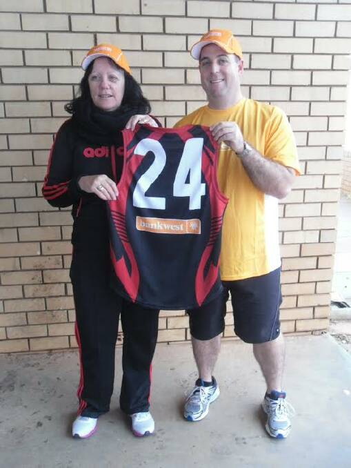Support: Bankwest's Lesley Parmenter and Ian Truscott with one of the new jumpers.
