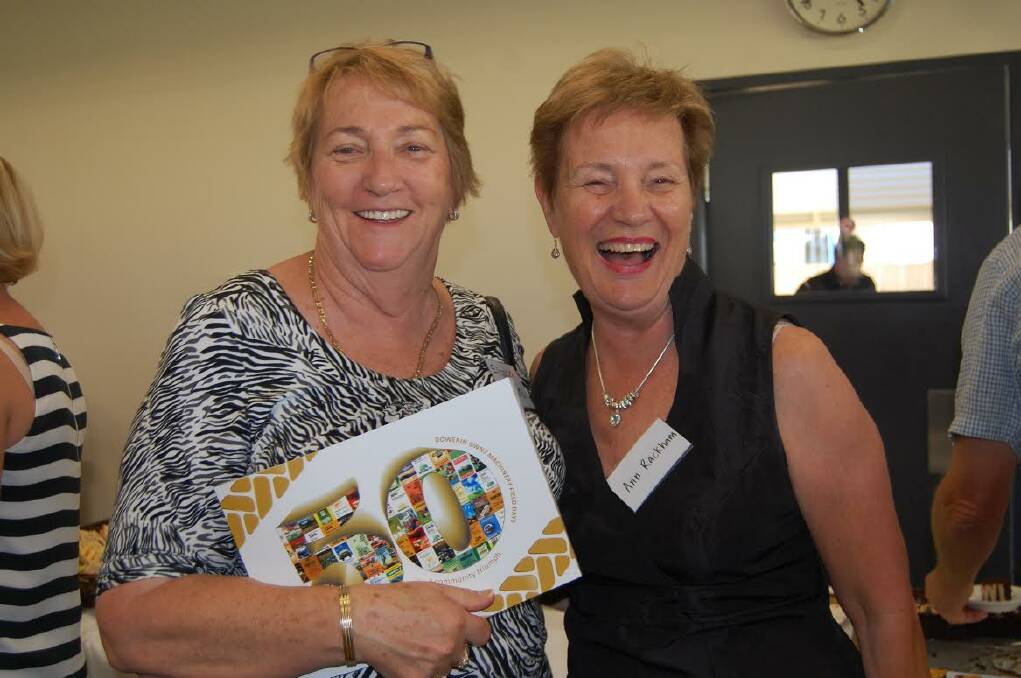 Fifty years: Elizabeth Worts and Ann Rackham show off the commemorative book.