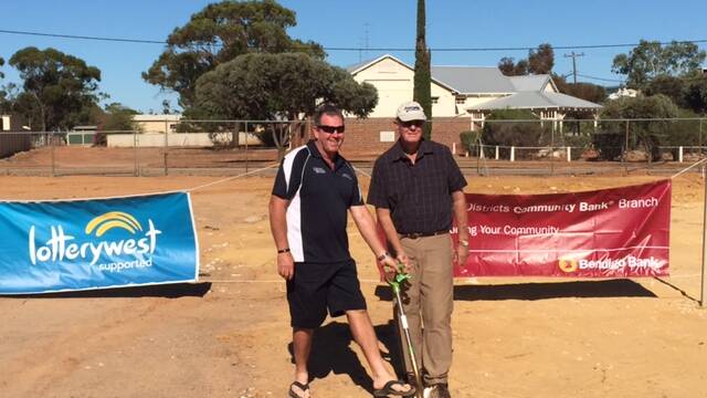 Shovel marks historic moment: Mortlock Sports Council president Lyndon Bird and Goomalling Shire president Doug Sewell share the honours in the ground-breaking ceremony for the sport and community centre.
