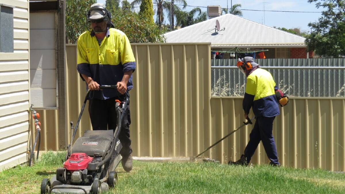Gardening: Share and Care workers Tim Edmonds and Josh Grafton gardening at a
Northam property.