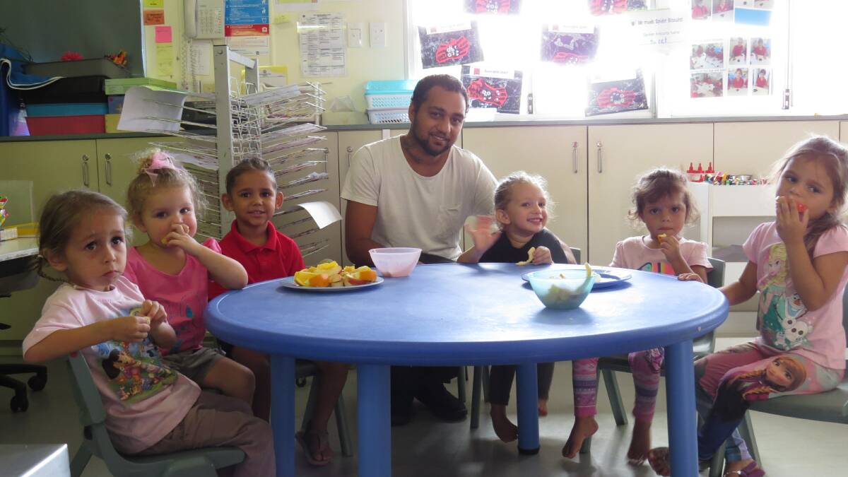 Fruit time: Tash, Angelee, Zayneisha, Rihanna and her father Gerald,
Yazmine and Tenneill at a KindiLink session last Thursday morning.