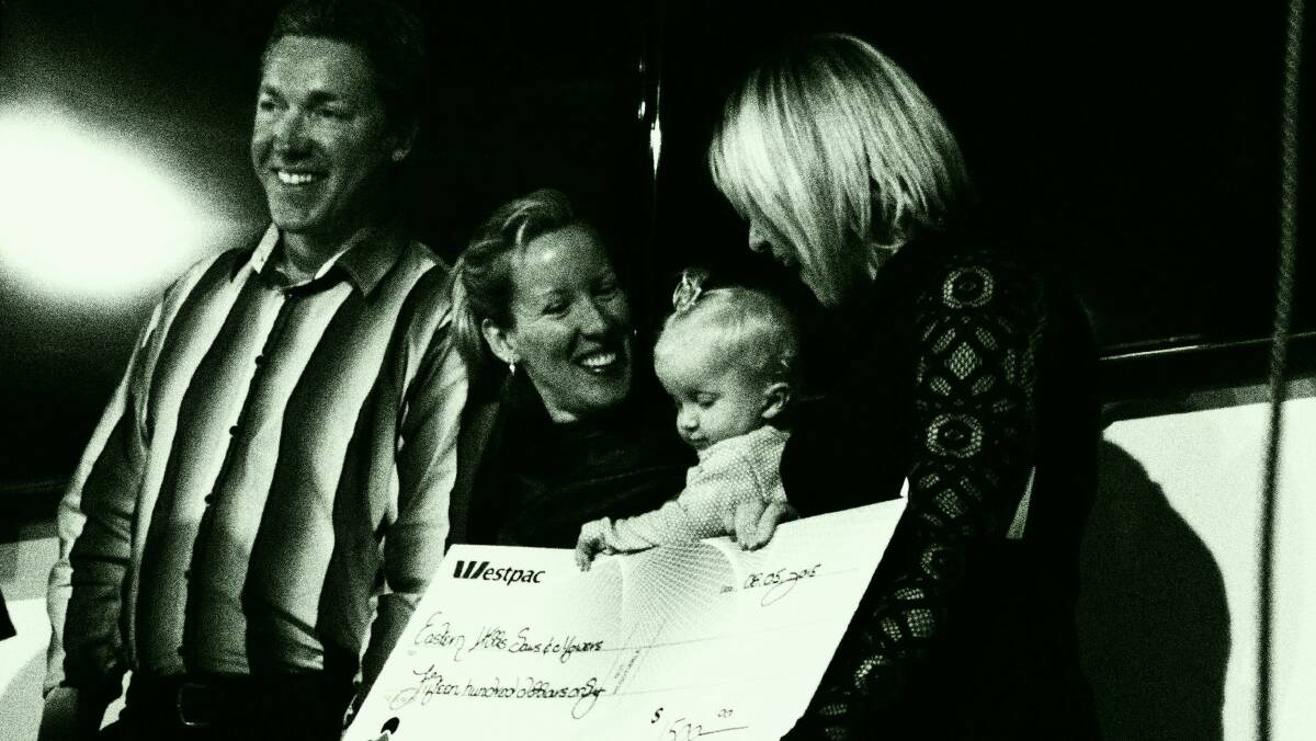 Fundraiser: Lachlan, Laura and Charlotte Patterson with Lucinda Smith handing over the cheque from Share and Care.