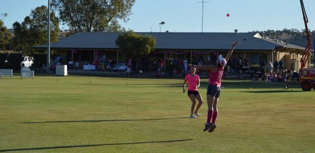 Dimity Boggs trying to take a high catch.