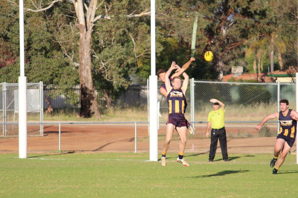 Spoiler: Lachie Dunkerton goes for a big spoil in the League game against York Roos. Photo: Tash Gillett. 