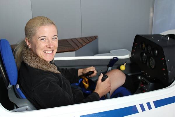Pilot in training: Chelsey has a go in the flight simulator.