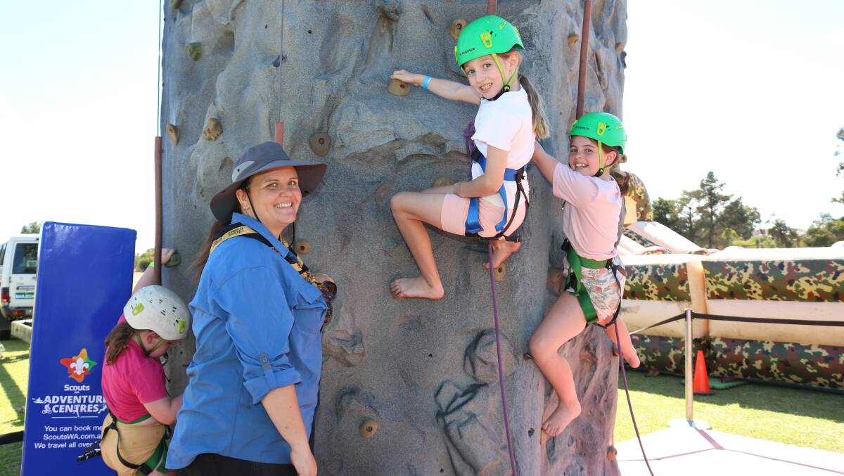  Erin Farling (left) manned the Scouts WA Adventure Centre mobile rock climbing wall and watched over climbers Giuliana Hough, 9, Narrogin and Rosalea Macey, 10, Williams.