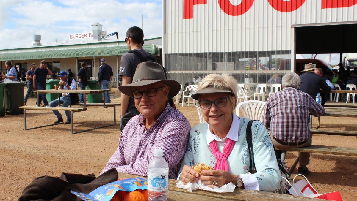 Retired Bindi Bindi farmer and former Liberal MLC for the Agricultural Region, Brian Ellis and his wife Margaret take a break and enjoy a hamburger for lunch.