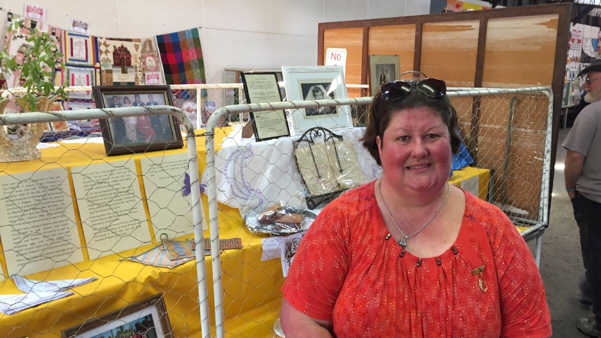 Fiona Brown takes time out from the Northam Agricultural Show on Saturday, in front of the display that paid tribute to her mum, Pauline Brown.