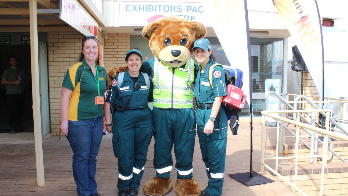 Emma Richards (left), one of the many Dowerin Shire staff helping at the Field Days, with Dowerin St John Ambulance volunteers Denise Sutherland and Carla Proud and their 'care bear' colleague.