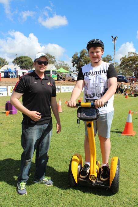 Jarryd Urbas from Chariots of Hire talks to Bodie Teale, Northam, about how to use a segway.