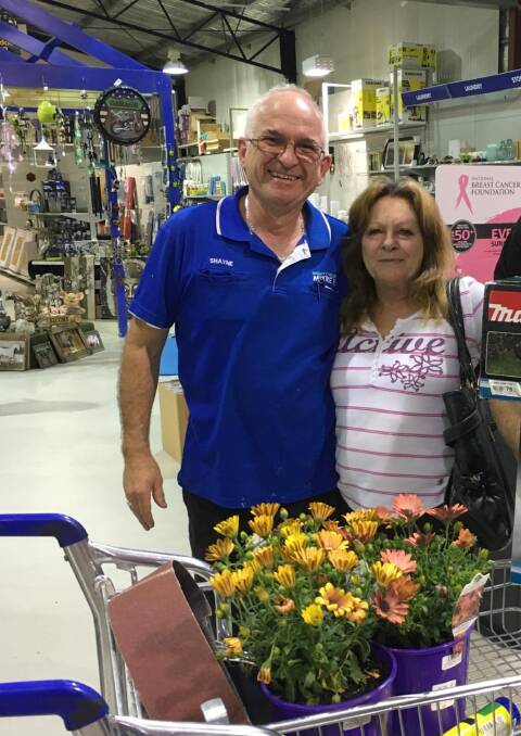 Rose Ozito is congratulated on her award win from Mitre 10 store manager Shayne Lucy.