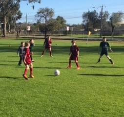 Action: Some of the set-up work by players in the Northam Springfield and Toodyay soccer action.