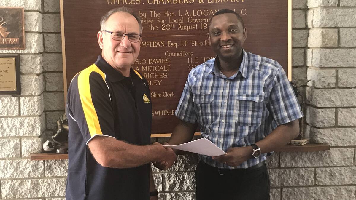 Wyalkatchem Shire Preident Cr Quentin Davies and GP Dr Emmanuel Awogun after signing a new three year agreement for medical services.