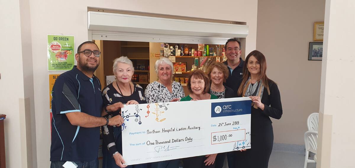 Arc Infrastructure employees Pav Vora, Murray Cook and Lee Ilic presenting a cheque to Northam Ladies Auxilliary members including Lorraine Tucker.