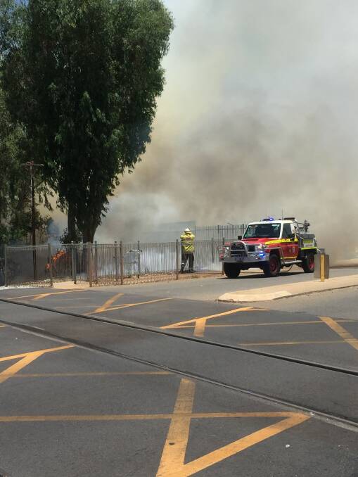 Under threat: Six fire trucks attended the fire on Fitzgerald Street that saw the Northam Railway line closed and damage to Northam Hyundai. The cause of the fire is unknown and police are investigating. Photo: Eliza Wynn.