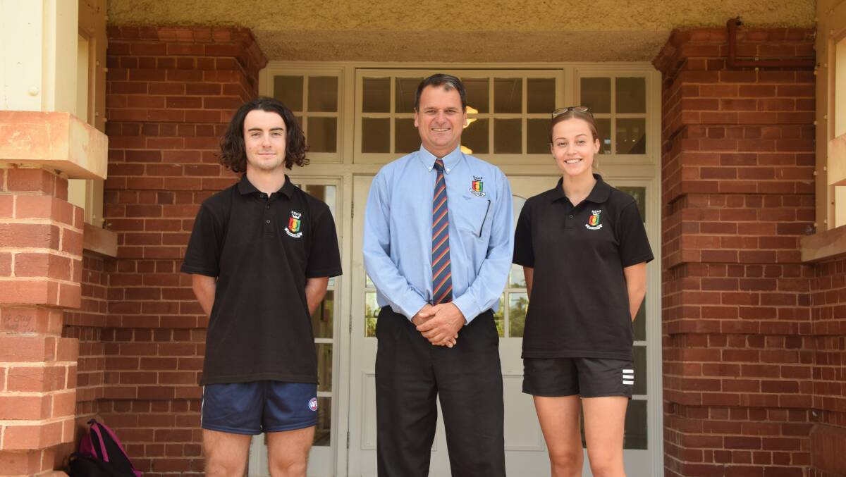 Northam Senior High School Principal, Terry Martino along side the 2018 head boy and head girl, Brodee Starcevich and Leilani Dunkerton, out the front of the school.