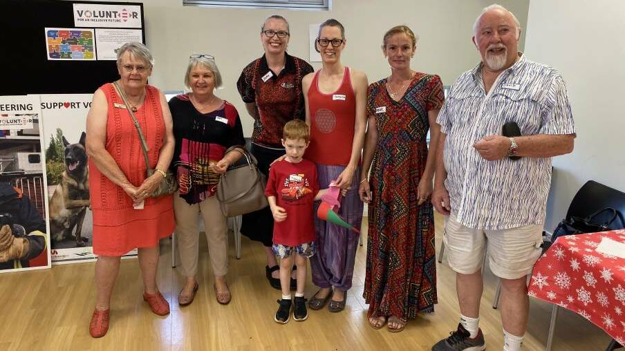 Colourful characters: Volunteers were invtied to wear red on International Volunteer Day. Photo: Supplied.