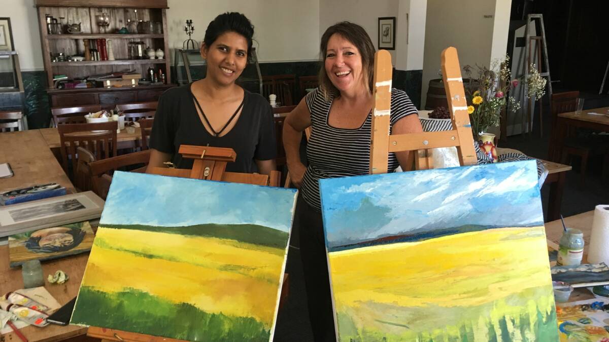 New project: Chiquita dos Reis and Holly Lamey with their works of art ready for mentoring sessions. Photo: supplied.